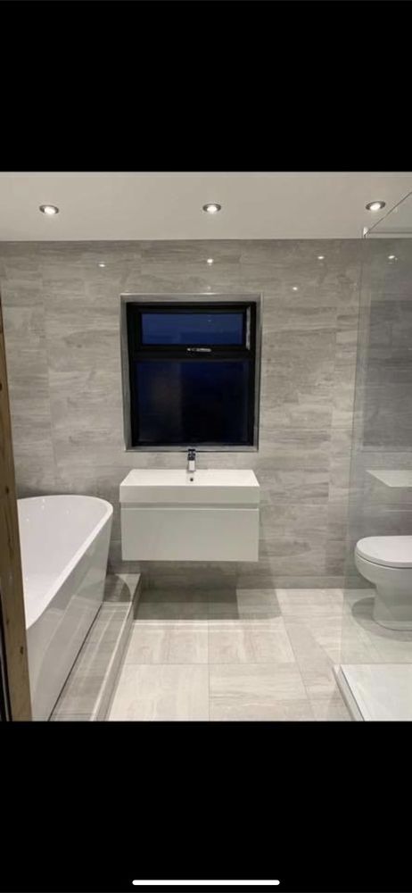 Luxury bathroom with freestanding sink and bath